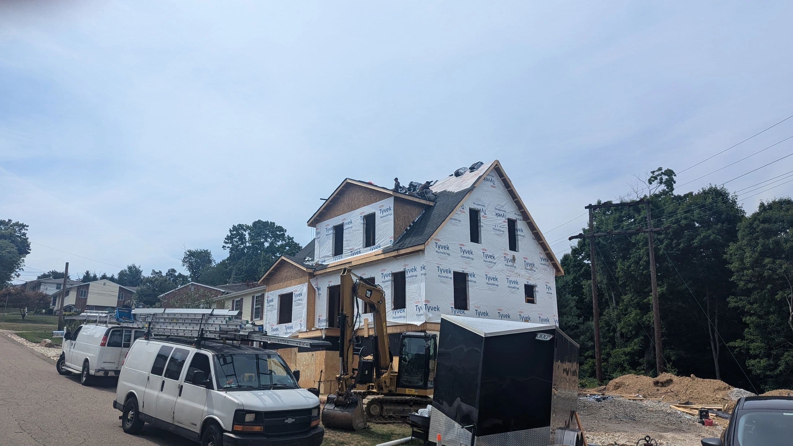 Hawkeye crew at a Pittsburgh job site with company vans